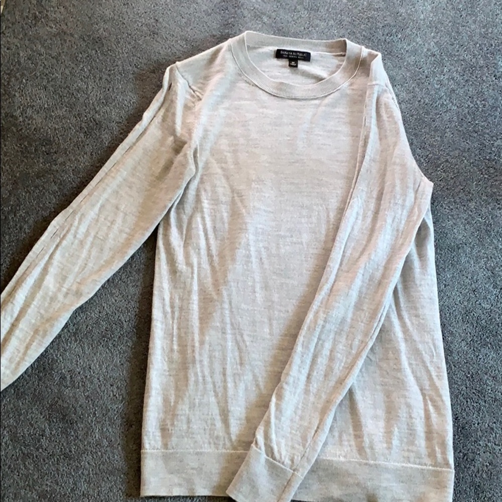 Sweater with peek holes down the sleeves